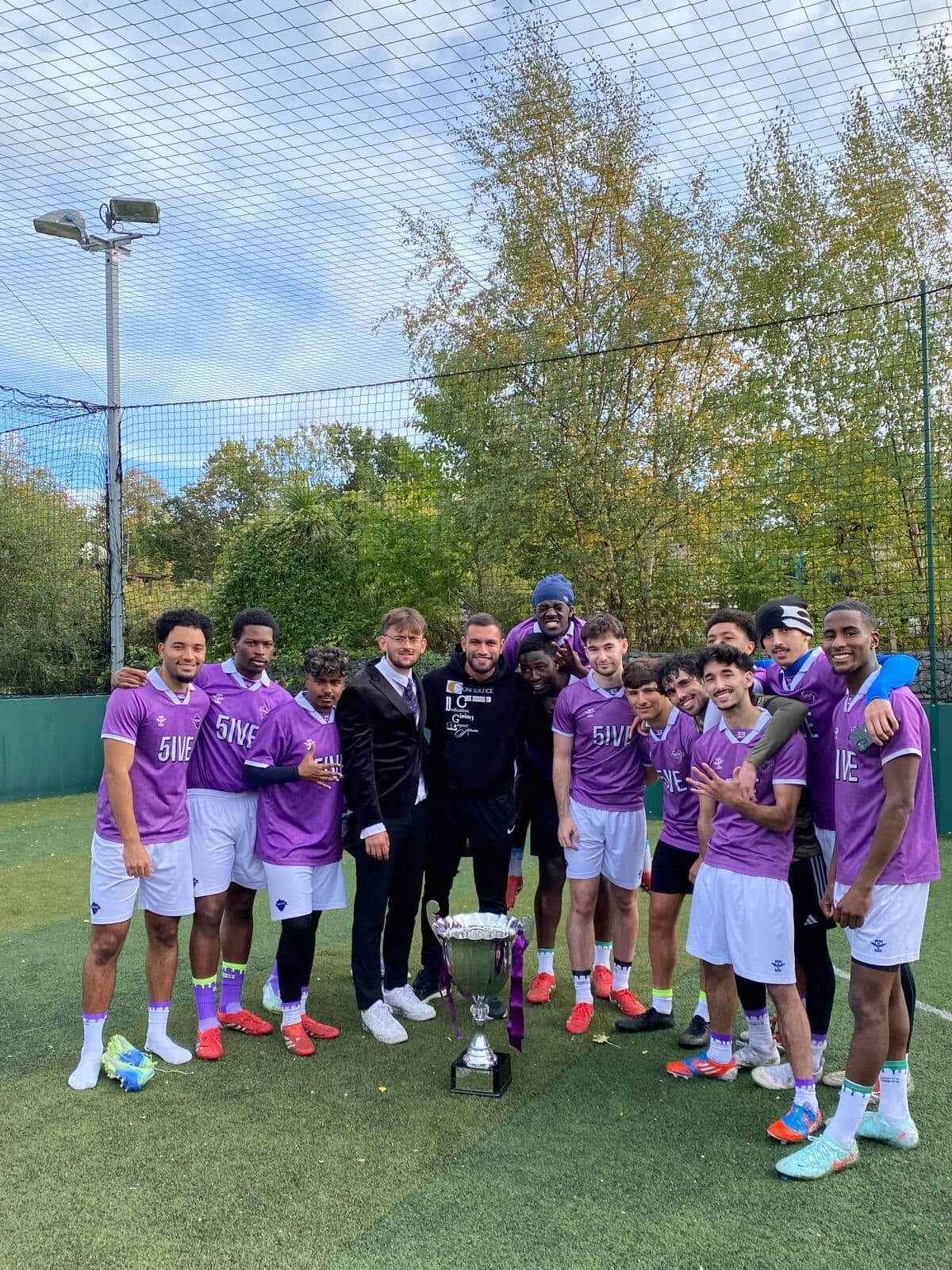 Five Guys FC with their first trophy, Coach Rafaz in the middle.